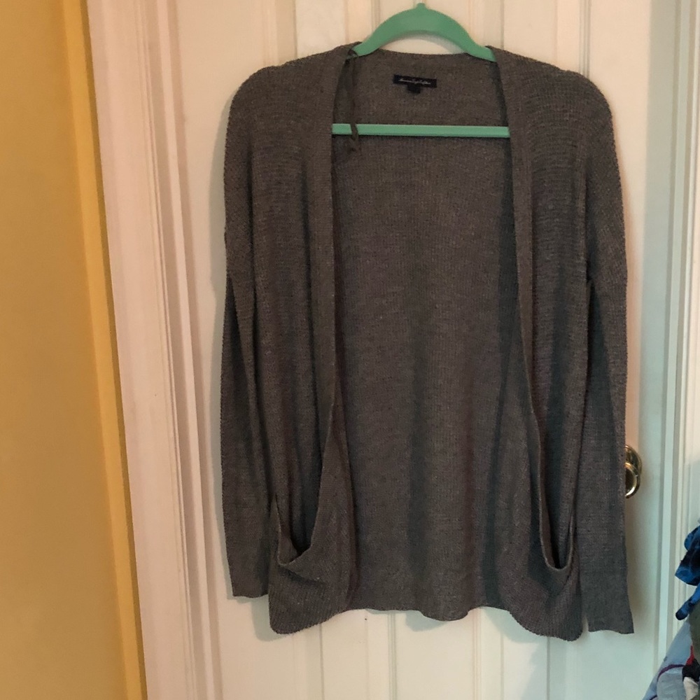 Light gray cardigan.